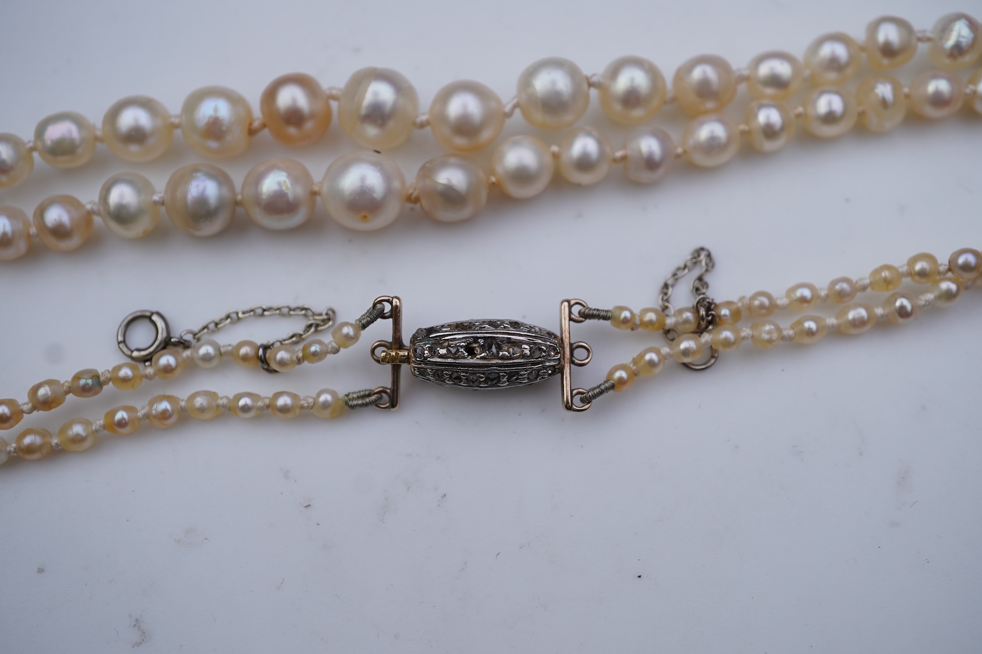 A natural pearl and diamond necklace, early 20th century